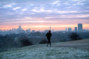 A man runs across Primrose Hill in north London