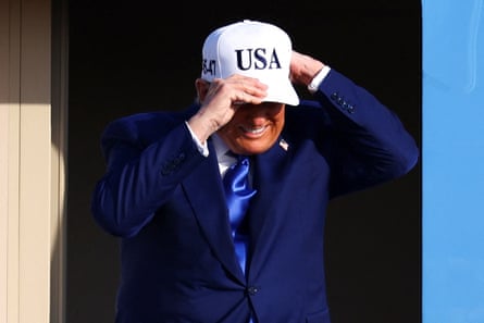 Man puts cap on head