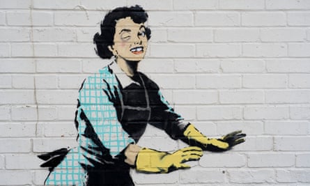 Detail of the Banksy artwork, which appears to show a 1950’s housewife, wearing a blue pinny and washing-up gloves, with a swollen eye and a missing tooth.