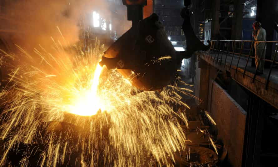 Molten iron being poured into a container at a steel plant in Hefei, Anhui province, China