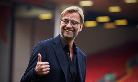 Jürgen Klopp is in confident mood as he heads on to the pitch after his official unveiling at Anfield.