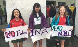 Students protest inaction by the Australian government on climate change outside Parliament House in Canberra.