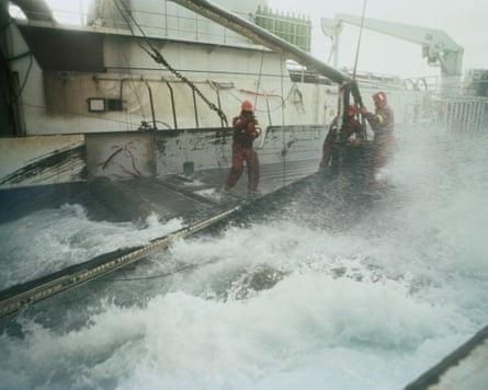 Crewmen on the deck of a trawler in the Bering Sea, Alaska.