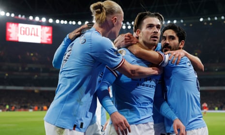 Jack Grealish is congratulated by his Manchester City teammates