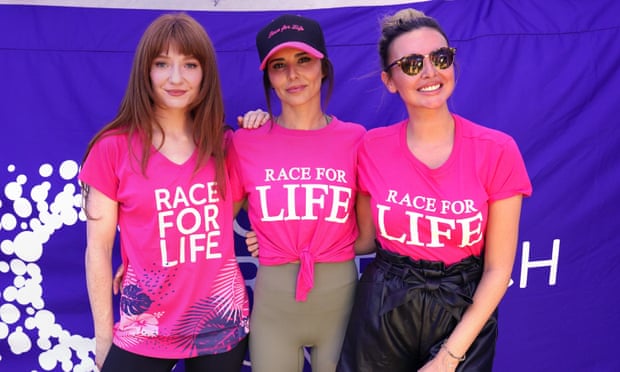 Nicola Roberts, Cheryl and Nadine Coyle in pink t-shirts with the words 'race for life' written on them