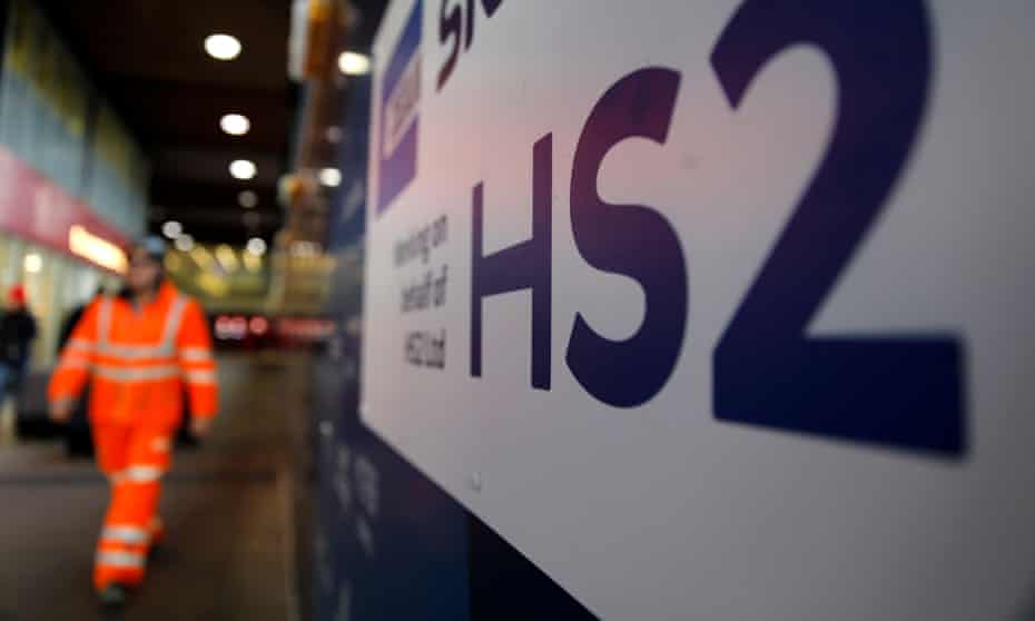 A worker walks past a construction site for a section of Britain's HS2 railway project at Euston station.
