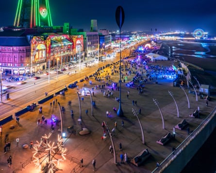 Blackpool seafront lit up at night.