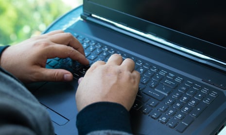 Hand on computer keyboard