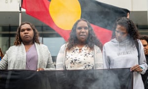 Francis Clarke (left) youngest sister, and Bernadette Clarke (centre), eldest sister of a woman referred to as 'JC' at family's request arrives with family and supporters at the district court of Western Australia