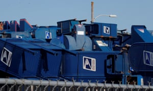 USPS mailboxes in a storage lot of a sandblasting and painting company in Hartford, Wisconsin. People who live nearby said the pile had grown noticeably larger in recent weeks.