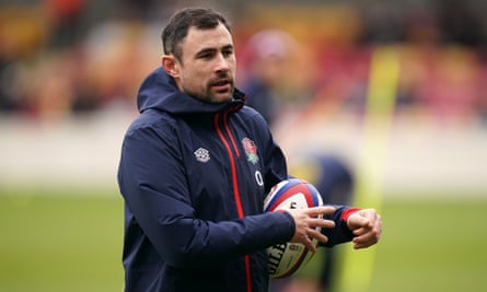 Felix Jones holds a rugby ball during an England training session.