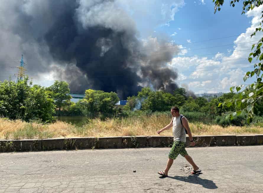 Smoke rises from the territory of an automotive centre following recent shelling in Donetsk