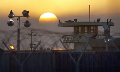 The sun rises on the Abu Ghraib prison on the outskirts of Baghdad, Iraq Tuesday, June 22, 2004. On Monday a judge declared the notorious prison a crime scene and forbade its destruction, as had been previously offered by President Bush.(AP Photo/John Moore)