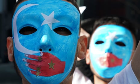 People protest at a pro-Uighur rally outside UN headquarters in New York.
