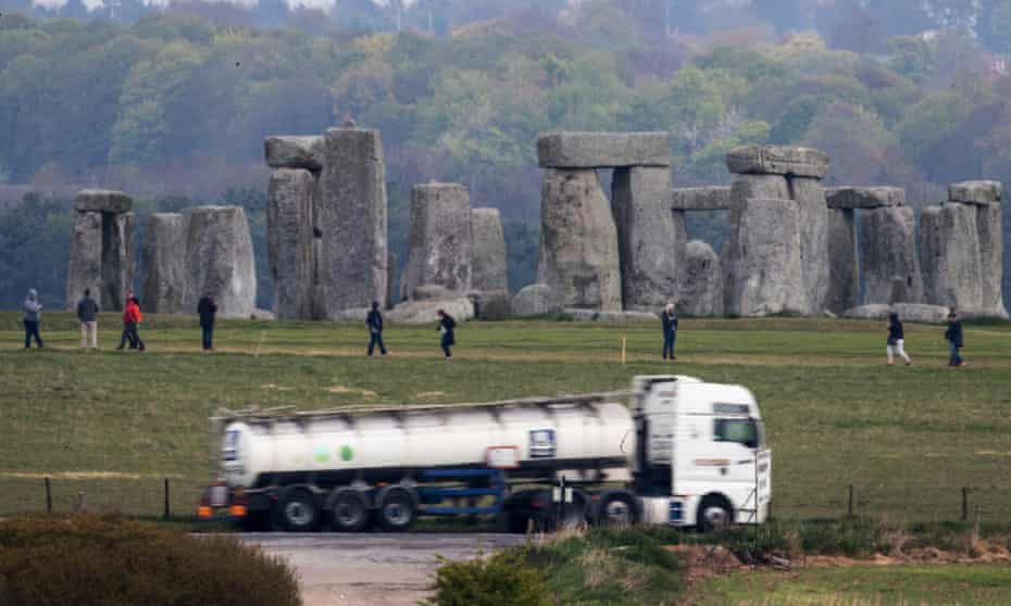 Traffic passes Stonehenge on the A303.