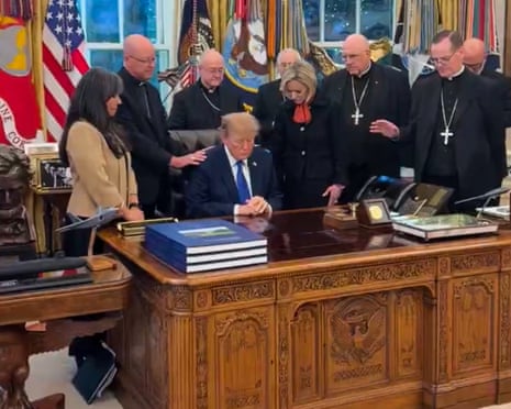 bishops pray around Donald Trump
