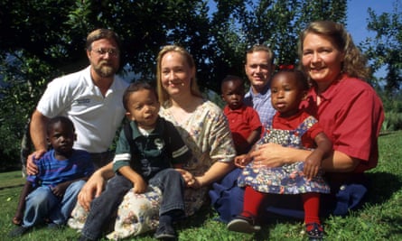 Rachel Dolezal in 1996 with her parents, Lawrence (left) and Ruthanne (right), her brother Joshua, and four young children the family had adopted
