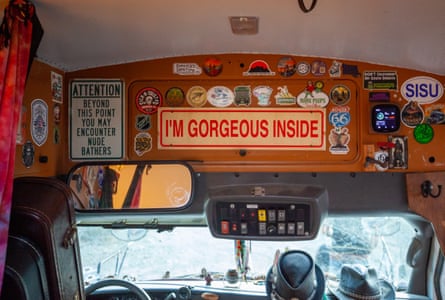 Stickers speckle the inside of a bus