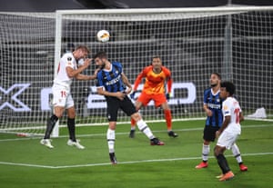 Sevilla’s Luuk de Jong guides a header across the face of goal past Samir Handanovic.