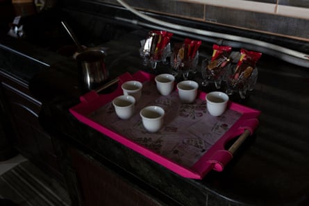 Six small Arabic coffee cups on a tray