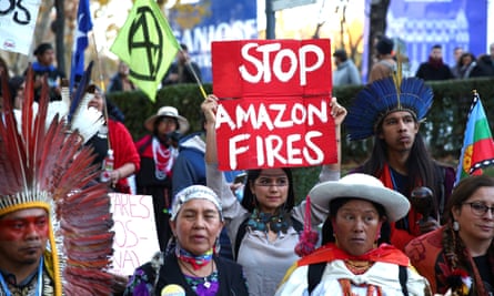 South American indigenous people attend a protest in Madrid, Spain, over the climate