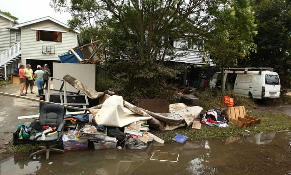 Residents in Brisbane clean up after flooding.