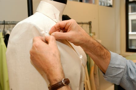 Pattern maker works on mannequin in New York on January 28, 2004. (© Frances M. Roberts)CTYJCN Pattern maker works on mannequin in New York on January 28, 2004. (© Frances M. Roberts)