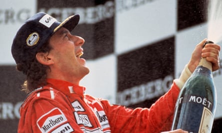 Ayrton Senna cracks open the champagne in Senna