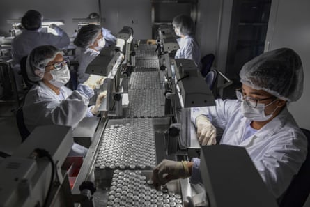 Employees work on the production line of CoronaVac, Sinovac Biotech’s vaccine against Covid, at the Butantan biomedical production centre, in Sao Paulo, Brazil.