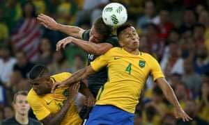 Germany’s Nils Petersen goes head to head with Brazil’s Walace and Marquinhos.