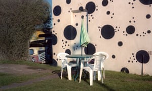 Table and Chairs Against a Spotty Wall