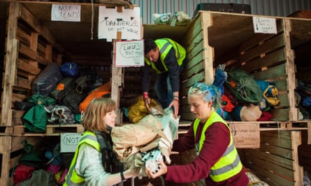 Help Refugees volunteers sorting donated tents at the warehouse in Calais.