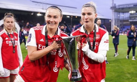 Caitlin Foord and Steph Catley hold the Conti cup trophy