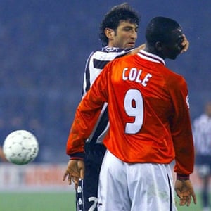 Juventus’ Ciro Ferrara pushes his hand into the face of Manchester United’s Andy Cole.