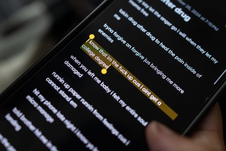 A detail image of a phone with song lyrics