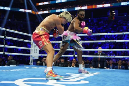 Jaron ‘Boots’ Ennis (right) throws a punch at Xander Zayas (left) during Saturday’s fight in Brooklyn.