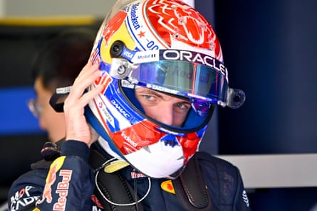 Max Verstappen in his helmet before climbing into his Red Bull car