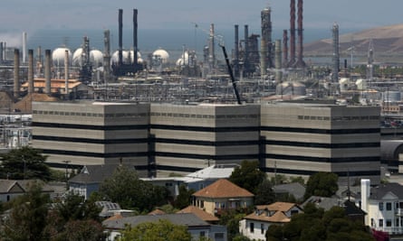 Homes stand amidst the Chevron oil refinery in Richmond, California
