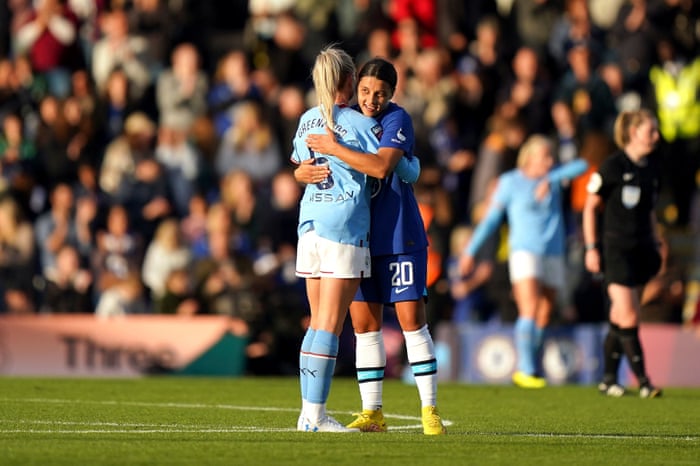 City's Greenwood and Chelsea's Kerr embrace after the final whistle.