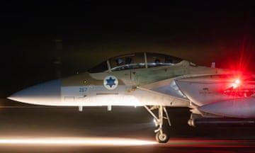 Israeli fighter jet on a runway in the dark