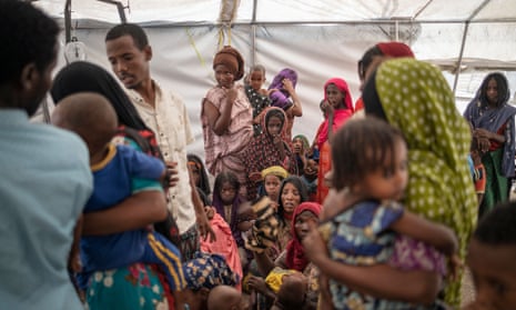 Women wait for child health checks at Guyah camp for displaced people in Afar, Ethiopia, May 2022