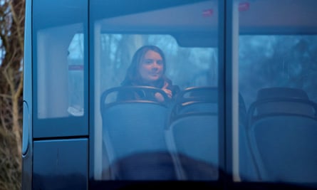 Thunberg sits in a police bus after her detention