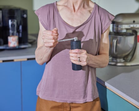 Emma Beddington using a manual coffee grinder.