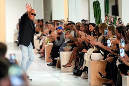 Michael Kors waves to the crowd.