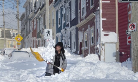 A resident digs a path from his house in St. John’s Newfoundland on Saturday, Jan. 18, 2020. The state of emergency ordered by the City of St. John’s is still in place, leaving businesses closed and vehicles off the roads in the aftermath of the major winter storm that hit the Newfoundland and Labrador capital. (Andrew Vaughan/The Canadian Press via AP)