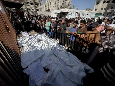 People attend funeral ceremonies as dozens of Palestinians lost their lives in attacks carried out by the Israeli army on the Gaza Strip in Khan Younis, Gaza.