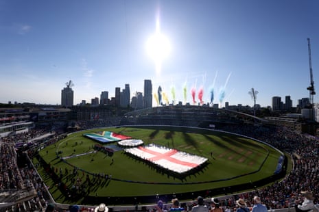 The players line up beside giant flags of their countries before the Women’s T20 World Cup semi-final match at The Oval.