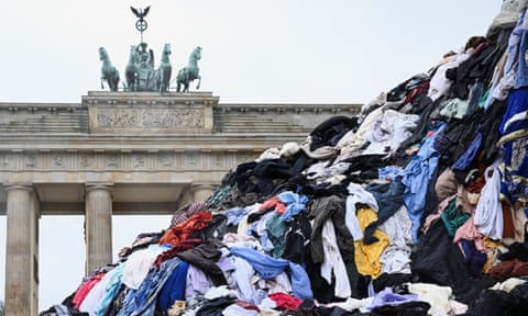 A protest against fast fashion in Berlin, with ‘a mountain’ of textile waste from a second-hand market in Ghana.