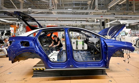 A technician works on a model of Volkswagen ID.4 at the carmaker’s plant in Zwickau, Germany