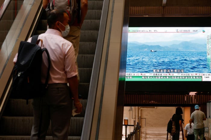A TV screen shows that China’s People’s Liberation Army has begun military exercises including live firing on the waters and in the airspace surrounding Taiwan.